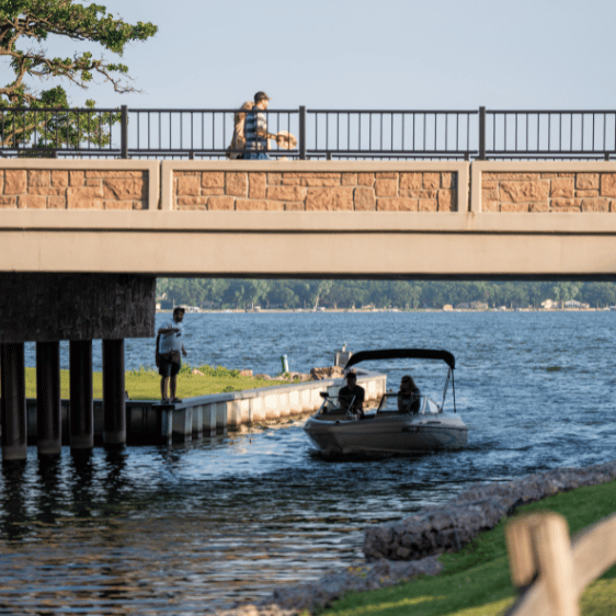 Boat going under the channel on the Fairmont Lakes located in Southern Minnesota