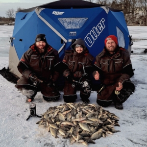 Legends Guide Service posing with their fish while ice fishing