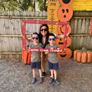 Mom and her sons posing for picture at Center Creek Orchard near Fairmont, Minnesota