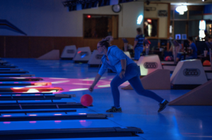 Person bowling at Bowlmor Lanes in Fairmont