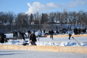 View of a hockey team playing in the Southern Minnesota Pond Hockey Rink on Lake Sisseton in Fairmont Minnesota