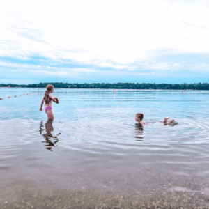 Kids swiming at the gomsrud beach in fairmont, mn