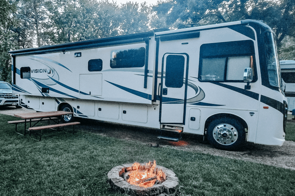 Camper parked near campfire at Flying Goose Campground near Fairmont, Minnesota