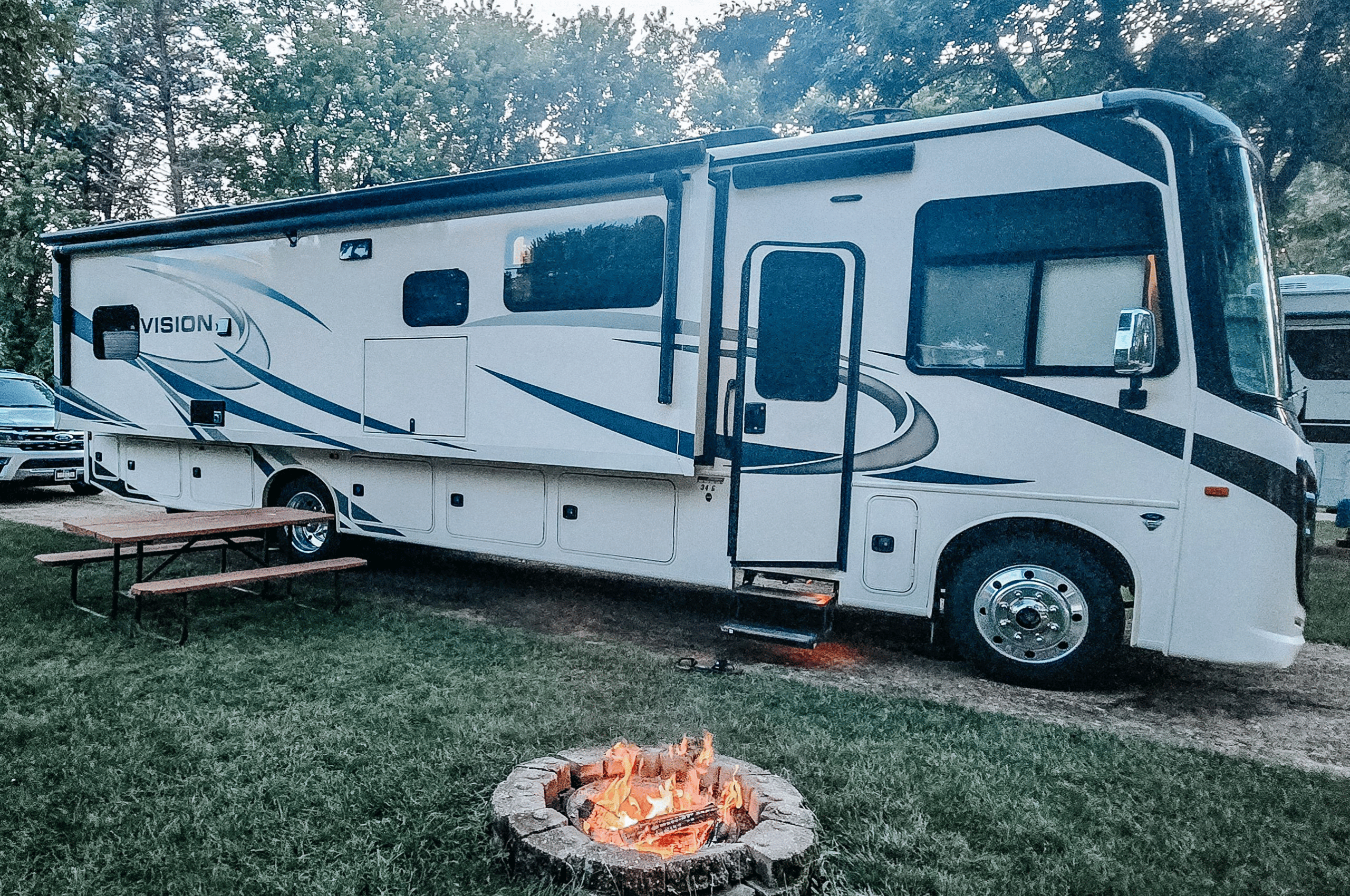 Camper parked near campfire at Flying Goose Campground near Fairmont, Minnesota