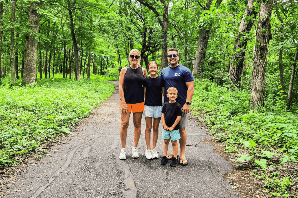 Family walking on a nature trail at Cedar Creek Park, in Fairmont