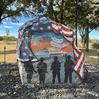 A photo of the Freedom Rock in Fairmont, Minnesota, a large painted rock honoring Martin County veterans.