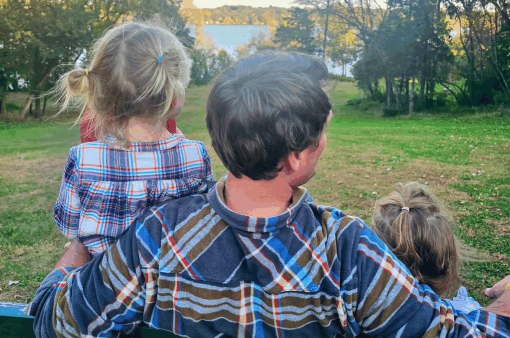 family at cedar creek park enjoying the lake views