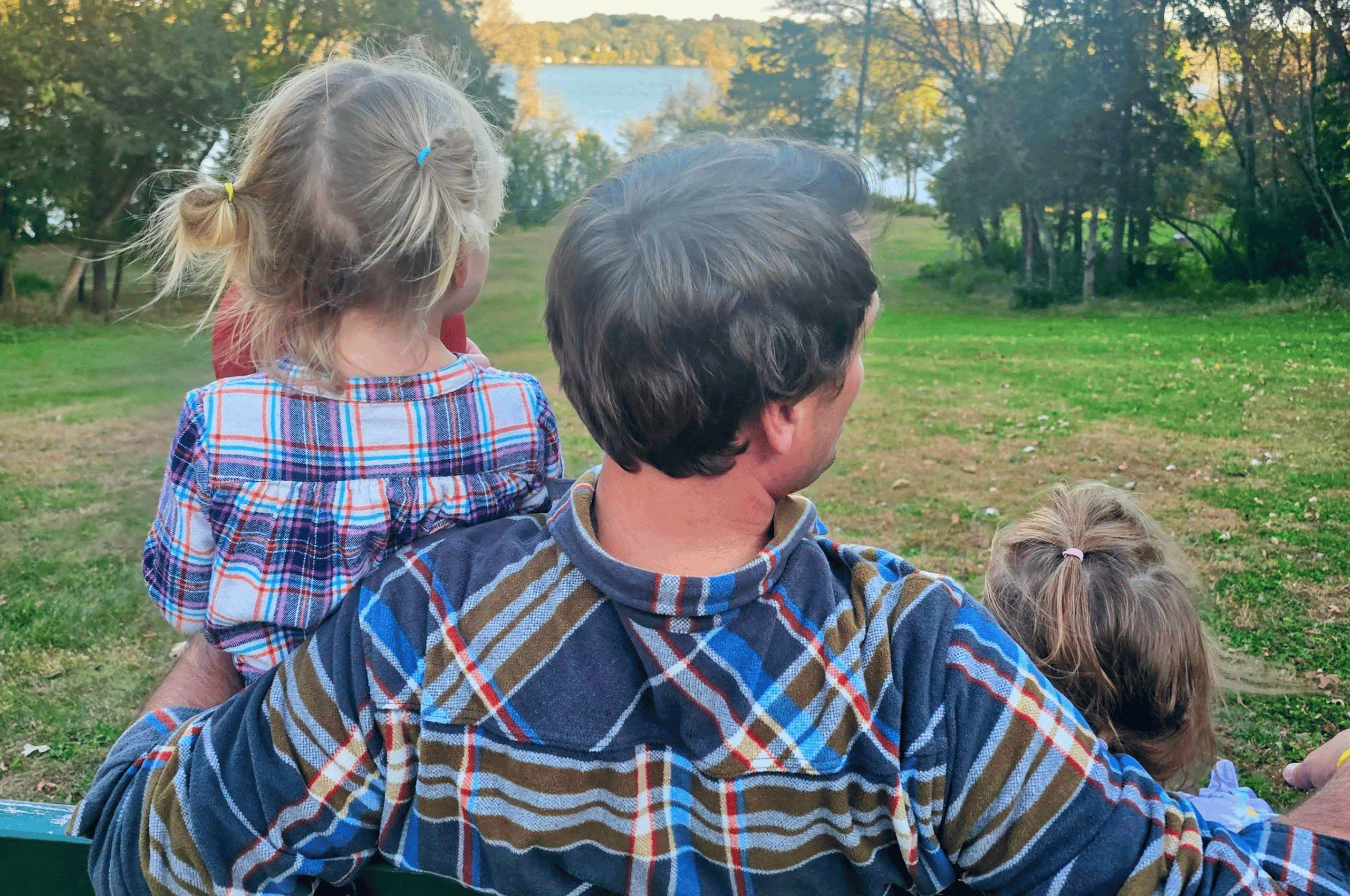 family at cedar creek park enjoying the lake views
